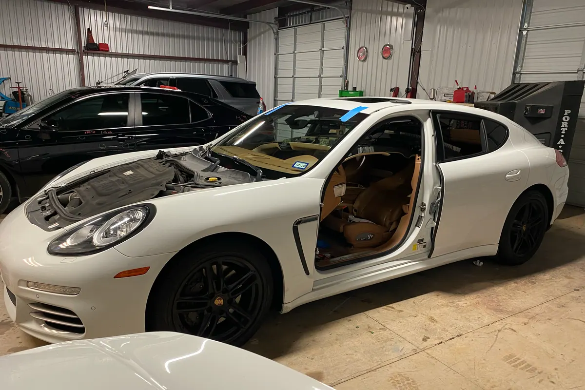 White Porsche Panamera during panel correction