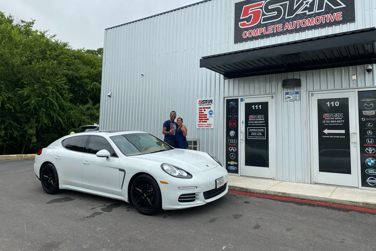White Porsche Panamera outside the 5Star Auto Hail Repair studio
